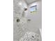 Modern shower featuring sleek marble-like tiling and contemporary fixtures for a luxurious bathing experience at 7128 E Bramble Berry Ln, Scottsdale, AZ 85266