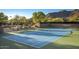 Well-maintained tennis court with mountain views at 7128 E Bramble Berry Ln, Scottsdale, AZ 85266