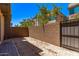 A low maintenance backyard with a privacy wall and desert landscaping at 7492 E Via De Luna Dr, Scottsdale, AZ 85255