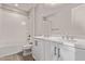 Bathroom with double sinks, ample lighting, and shower over tub with a toilet at 7492 E Via De Luna Dr, Scottsdale, AZ 85255