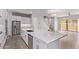 Open floorplan with island including dishwasher, stainless steel refrigerator, and modern countertops at 7492 E Via De Luna Dr, Scottsdale, AZ 85255