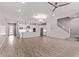 Open floorplan with bright white kitchen, large island, and modern stainless steel appliances at 7492 E Via De Luna Dr, Scottsdale, AZ 85255