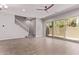 Bright open floorplan with neutral walls, tile floors, stairs, and backyard access at 7492 E Via De Luna Dr, Scottsdale, AZ 85255