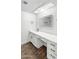 Bathroom vanity featuring white cabinets, a sleek mirror, and a clean countertop area at 7730 W Mulberry Dr, Phoenix, AZ 85033