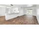 Open living space showcasing the kitchen bar, dining area, and sliding glass doors to the outside at 7730 W Mulberry Dr, Phoenix, AZ 85033