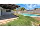 A refreshing pool surrounded by a secure fence awaits in this backyard at 7730 W Mulberry Dr, Phoenix, AZ 85033