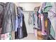 Spacious walk-in closet with ample hanging space and shelving for organized storage at 8132 E Onza Ave, Mesa, AZ 85212