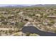An aerial view of a house surrounded by desert landscaping and other homes in a beautiful neighborhood at 8698 E Preserve Way, Scottsdale, AZ 85266
