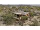Back aerial view of an orange home featuring a patio, desert landscaping, and a pool at 8698 E Preserve Way, Scottsdale, AZ 85266