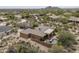 Stunning aerial view of a desert home featuring a private pool, patio, and lush desert landscaping at 8698 E Preserve Way, Scottsdale, AZ 85266