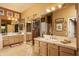 Bright bathroom boasts dual sinks, vanity with great lighting, and a spacious walk-in closet at 8698 E Preserve Way, Scottsdale, AZ 85266