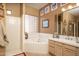 Well-lit bathroom features a bathtub, walk-in shower, and a convenient sink area at 8698 E Preserve Way, Scottsdale, AZ 85266