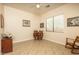 Bright bedroom features a desk with a chair, a window view, and a rocking chair at 8698 E Preserve Way, Scottsdale, AZ 85266