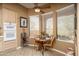 Cozy breakfast nook with large windows and a ceiling fan at 8698 E Preserve Way, Scottsdale, AZ 85266
