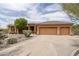 Charming single-Gathering home with a spacious driveway, three-car garage, and desert landscaping at 8698 E Preserve Way, Scottsdale, AZ 85266