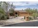 Attractive single-Gathering home with desert landscaping, three-car garage, and a circular driveway at 8698 E Preserve Way, Scottsdale, AZ 85266