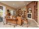 Inviting living room with a cozy fireplace and sliding glass doors at 8698 E Preserve Way, Scottsdale, AZ 85266