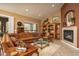 Comfortable living room with a fireplace and traditional decor elements at 8698 E Preserve Way, Scottsdale, AZ 85266