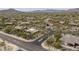 Picture of a street in a housing community with desert landscaping and a home in the distance at 8698 E Preserve Way, Scottsdale, AZ 85266