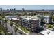 Aerial view showing an apartment complex with palm tree lined street at 914 E Osborn Rd # 404, Phoenix, AZ 85014