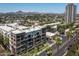 Scenic aerial view showcases the community, nearby cityscape, and mountain views at 914 E Osborn Rd # 404, Phoenix, AZ 85014
