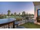 Balcony with seating offers serene golf course views framed by swaying palm trees at 914 E Osborn Rd # 404, Phoenix, AZ 85014