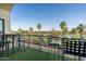 Inviting balcony with bar-style seating offering picturesque views of the sprawling golf course at 914 E Osborn Rd # 404, Phoenix, AZ 85014