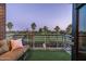 Balcony with views of golf course, cozy seating, and an artificial lawn at 914 E Osborn Rd # 404, Phoenix, AZ 85014