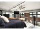 Spacious bedroom featuring exposed brick, modern ceiling fan and industrial style duct work at 914 E Osborn Rd # 404, Phoenix, AZ 85014