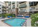 Inviting community pool with comfortable lounge seating and lush greenery for relaxation at 914 E Osborn Rd # 404, Phoenix, AZ 85014