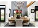Charming dining room featuring a rustic wood table, elegant chandelier, and views to the outdoors at 914 E Osborn Rd # 404, Phoenix, AZ 85014