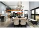 Dining room featuring a rustic table, chandelier, and views of the golf course at 914 E Osborn Rd # 404, Phoenix, AZ 85014