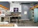 Modern kitchen with stainless steel appliances, open shelving, and concrete countertops at 914 E Osborn Rd # 404, Phoenix, AZ 85014