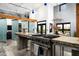 This modern kitchen features stainless steel appliances, a central island, and a breakfast bar at 914 E Osborn Rd # 404, Phoenix, AZ 85014
