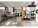 Open-concept kitchen and dining area with modern appliances and concrete flooring at 914 E Osborn Rd # 404, Phoenix, AZ 85014