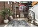 Inviting living area with exposed brick, spiral staircase, and ample natural light at 914 E Osborn Rd # 404, Phoenix, AZ 85014