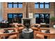 This gorgeous living room features a fireplace, exposed brick, and modern seating at 914 E Osborn Rd # 404, Phoenix, AZ 85014