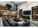 Modern living room with an open mezzanine and stylish black shelving at 914 E Osborn Rd # 404, Phoenix, AZ 85014