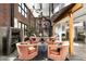 Spacious living room featuring exposed brick, industrial accents, and comfortable seating at 914 E Osborn Rd # 404, Phoenix, AZ 85014