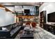 Modern living room with comfortable seating, a decorative area rug, and a view of the loft area at 914 E Osborn Rd # 404, Phoenix, AZ 85014