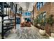 Stunning living room features exposed brick, a spiral staircase, and plenty of natural light at 914 E Osborn Rd # 404, Phoenix, AZ 85014