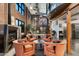 The cozy living room features a fireplace, exposed brick walls, spiral staircase, and loft access at 914 E Osborn Rd # 404, Phoenix, AZ 85014