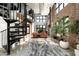 Spacious living room with tall windows, spiral staircase and exposed brick at 914 E Osborn Rd # 404, Phoenix, AZ 85014
