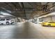 Well-lit parking garage with ample parking spaces and visible support beams at 914 E Osborn Rd # 404, Phoenix, AZ 85014
