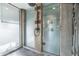 Contemporary shower with textured shower surround and a matte black shower head and fixture at 914 E Osborn Rd # 404, Phoenix, AZ 85014