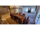 Spacious dining room featuring a wooden table, chandelier, and a seamless transition to the living area at 9505 E Jenan Dr, Scottsdale, AZ 85260