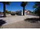 Charming single-story home with a well-maintained yard, mature trees, and a private driveway at 9505 E Jenan Dr, Scottsdale, AZ 85260