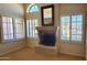 Cozy fireplace with travertine and large mirror for decor in living room at 9505 E Jenan Dr, Scottsdale, AZ 85260