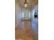 Bright foyer featuring tile flooring, white door and clear view to living room at 9505 E Jenan Dr, Scottsdale, AZ 85260