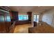 Gourmet kitchen features dark wood cabinets, granite countertops, stainless steel appliances, and views of the pool at 9505 E Jenan Dr, Scottsdale, AZ 85260